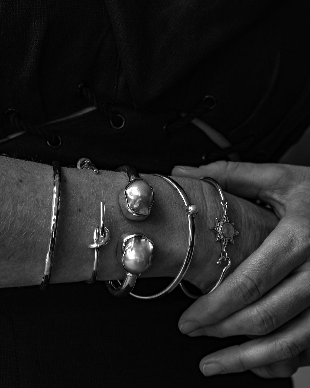 model wears a selection of bangles