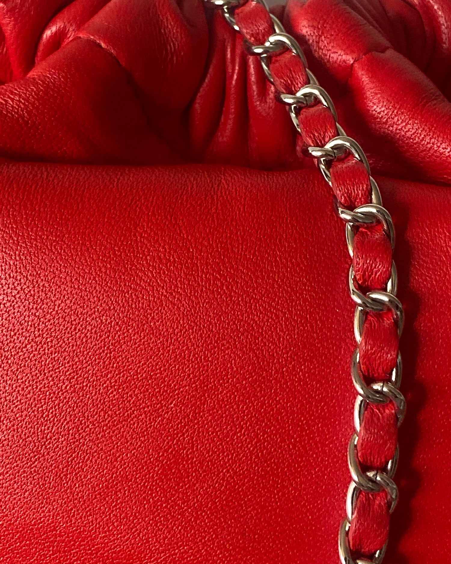 Closeup of red leather and strap handle