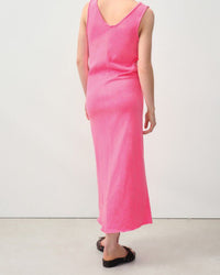 Model wears a fluro pink tank style dress with a raw edge neckline