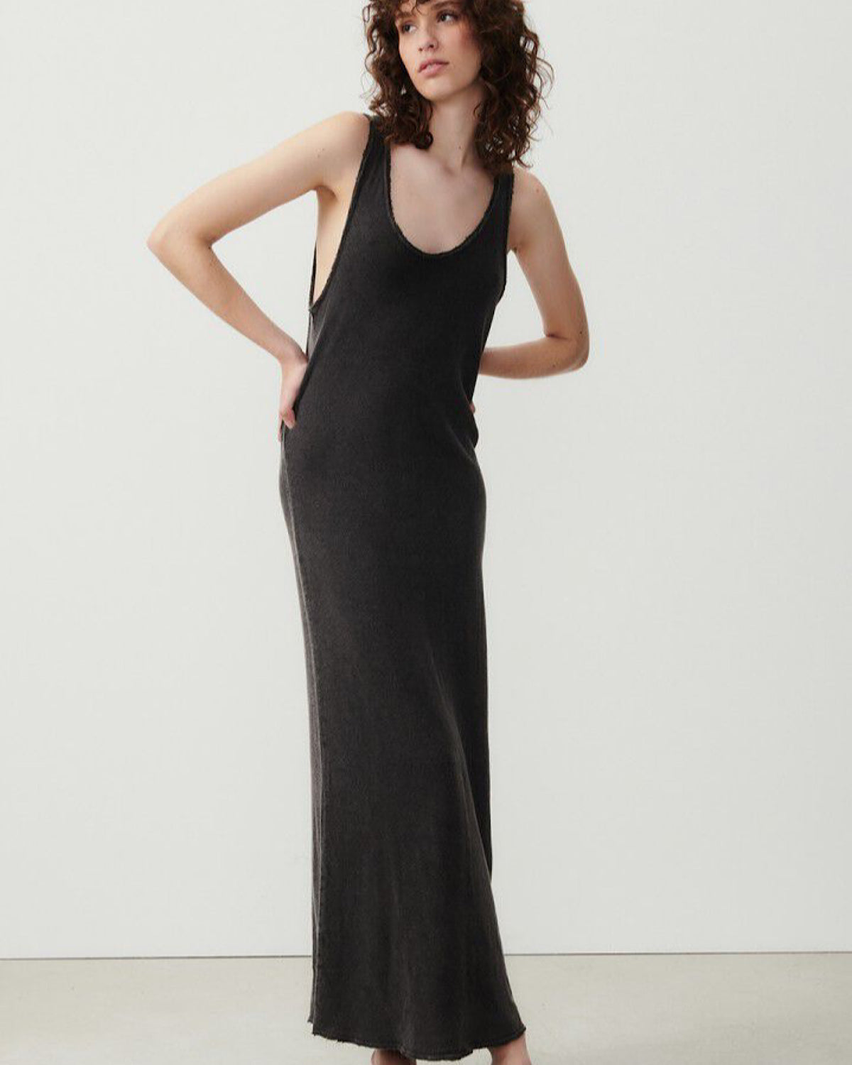 Model wears a long maxi tank style washed black cotton Sonoma tank dress by American Vintage available at The Pared Store