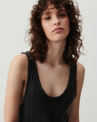 Model wears a scoop neck raw edge cotton Sonoma tank dress by American Vintage