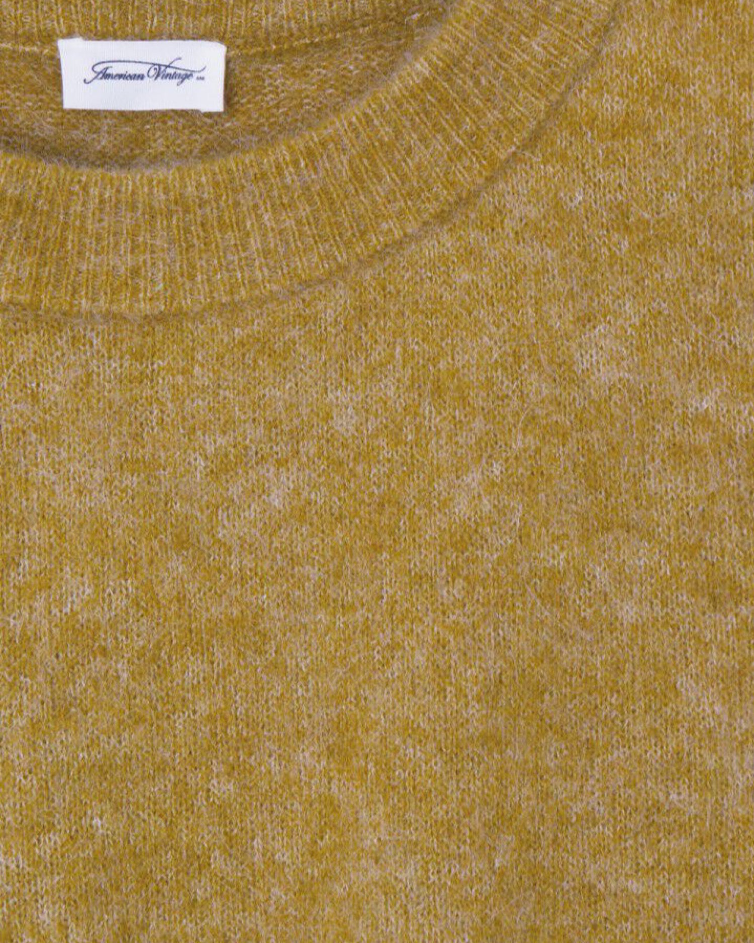 detail of a fluffy vitow sweater in canyon from the Pared Store which is a warm khaki tone