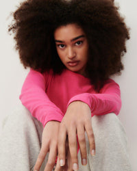 a model wears a hot pink t