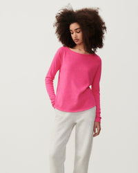 model wears a hot pink coloured boat neck long sleeve T-shirt