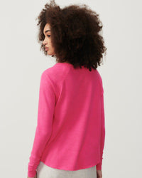 model wears a hot pink coloured boat neck long sleeve T-shirt