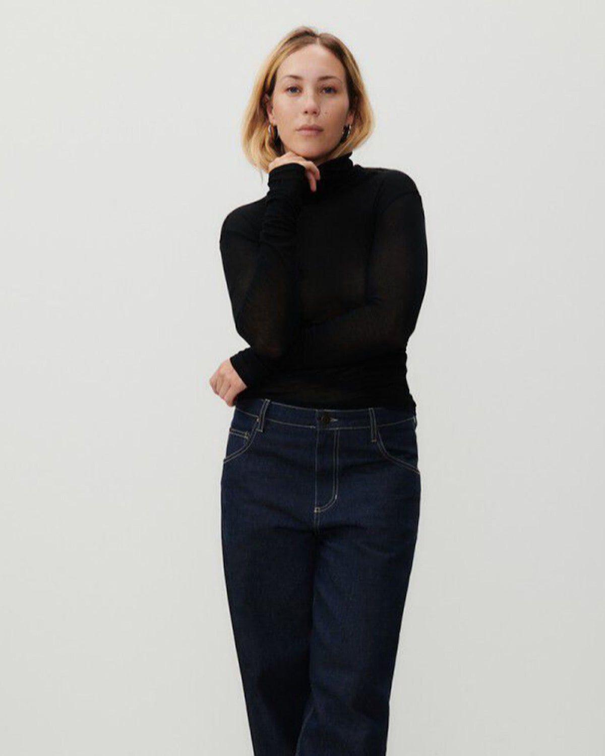 model wears a black skivvy