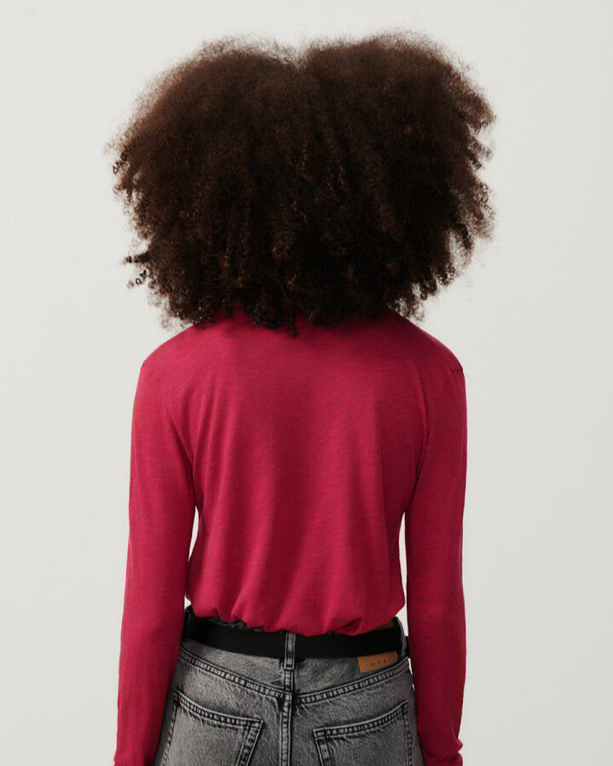 model wearsA V neck long sleeve raspberry red t-shirt