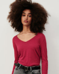 model wearsA V neck long sleeve raspberry red t-shirt