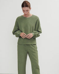 a green boucle style sweatshirt and pants on a model