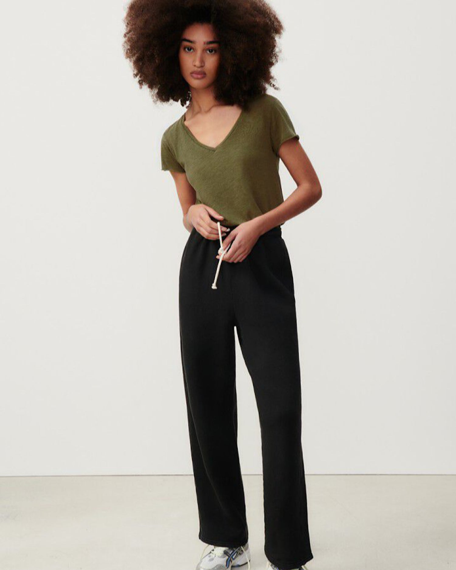 an olive green v neck slub t-shirt on a model