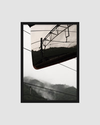 Framed  photograph of power lines against a mountainous landscape in japan