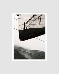 photograph of power lines with a mountainous background