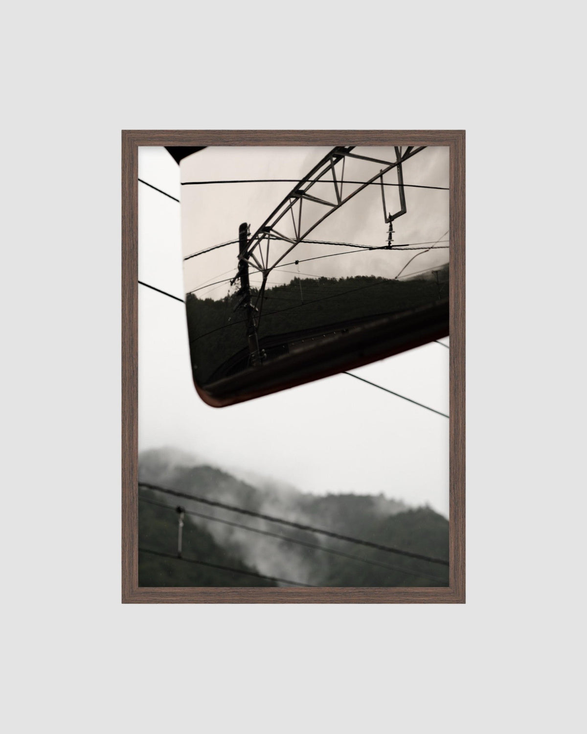 framed photo of power lines and a mountain backdrop in japan