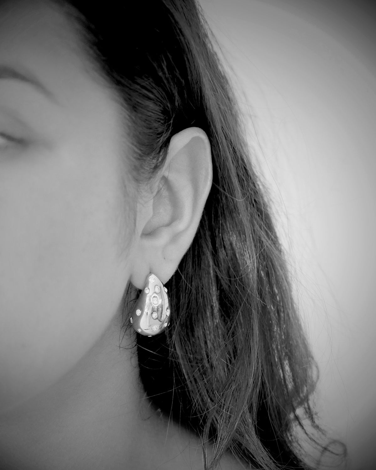 model wears silver crystal sloane earrings