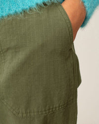 Green pants with a textured pattern on a plain background