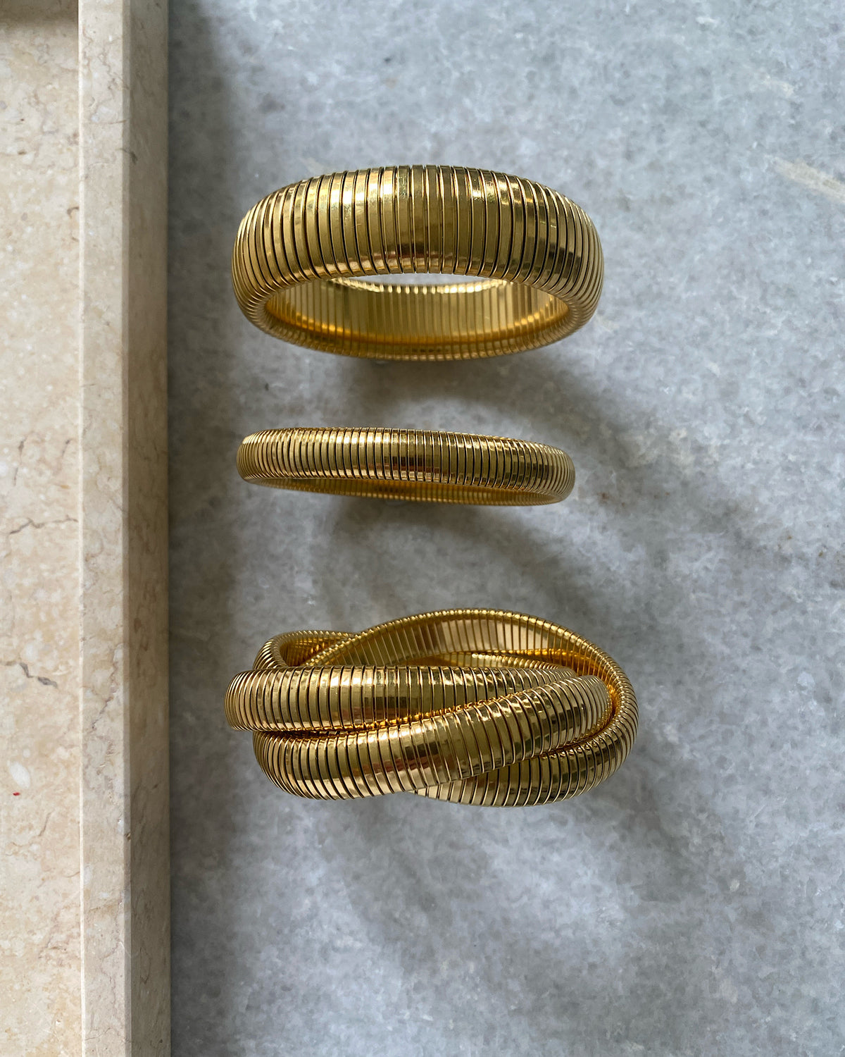 Three sizes of snake bangle