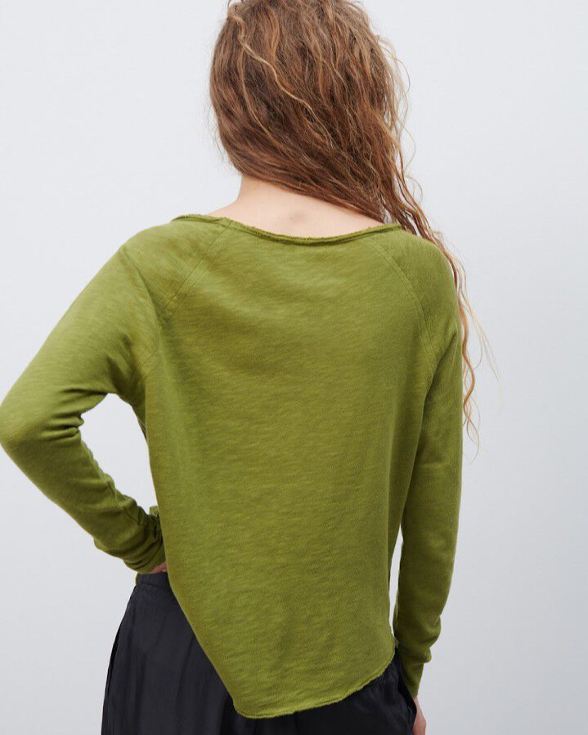 Model wears a Sonoma boat neck long sleeve in Cameleon green by American Vintage