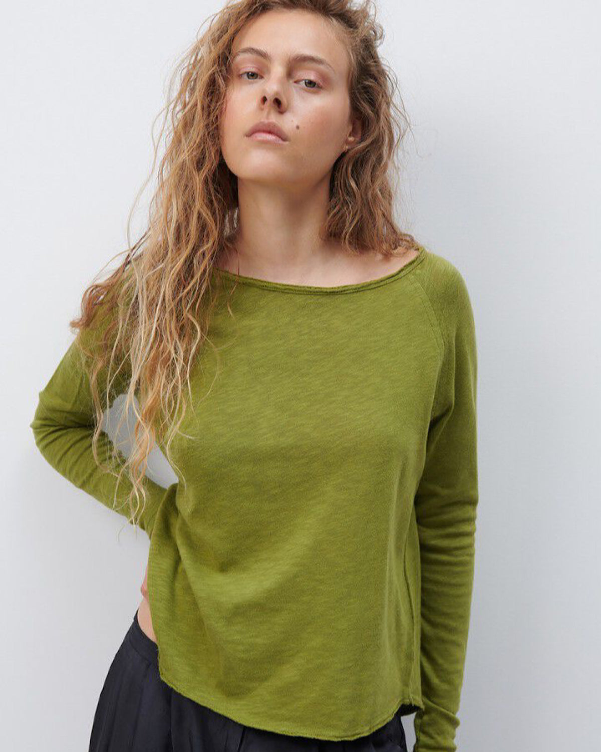 Model wears a Sonoma boat neck long sleeve in Cameleon green by American Vintage