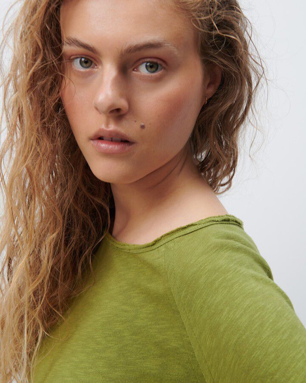 Model wears a Sonoma boat neck long sleeve in Cameleon green by American Vintage