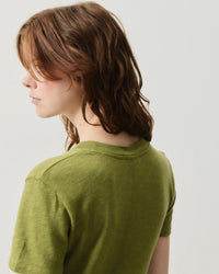 Model wears an American  Vintage Sonoma round neck T-shirt in Cameleon green