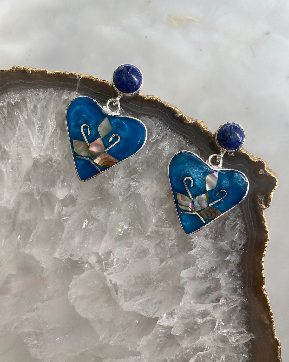 Turquoise coloured heart drop earrings with abalone embellishment