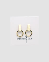 Gold rectangular studs with open hoops handing from them on a card