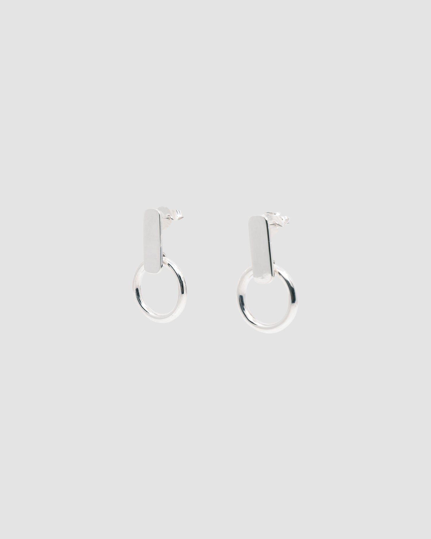 silver square stud earrings with a ring attached