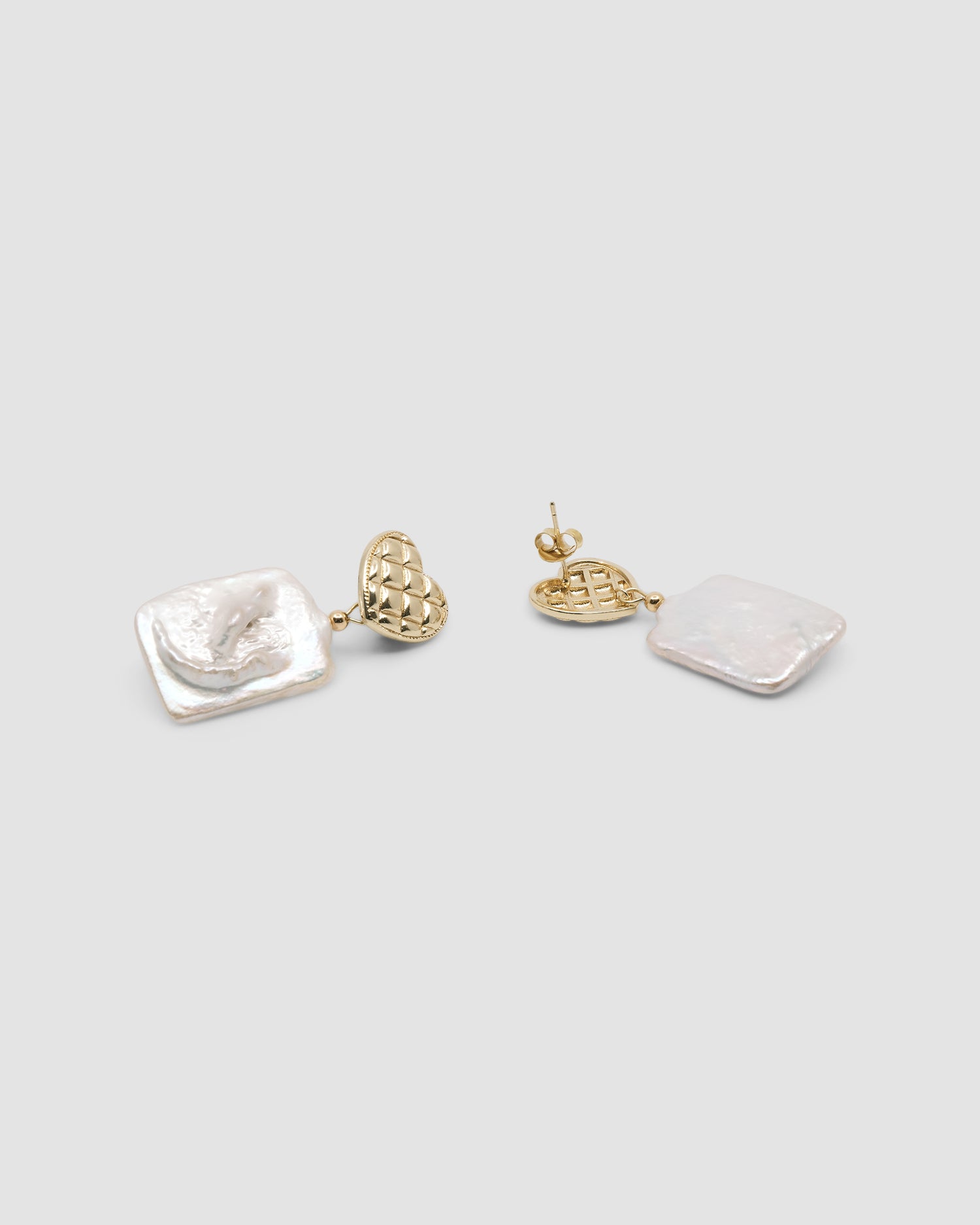 gold quilted studs with rectangular pearls hanging from them