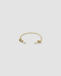 Gold open style bangle with two knots at the end