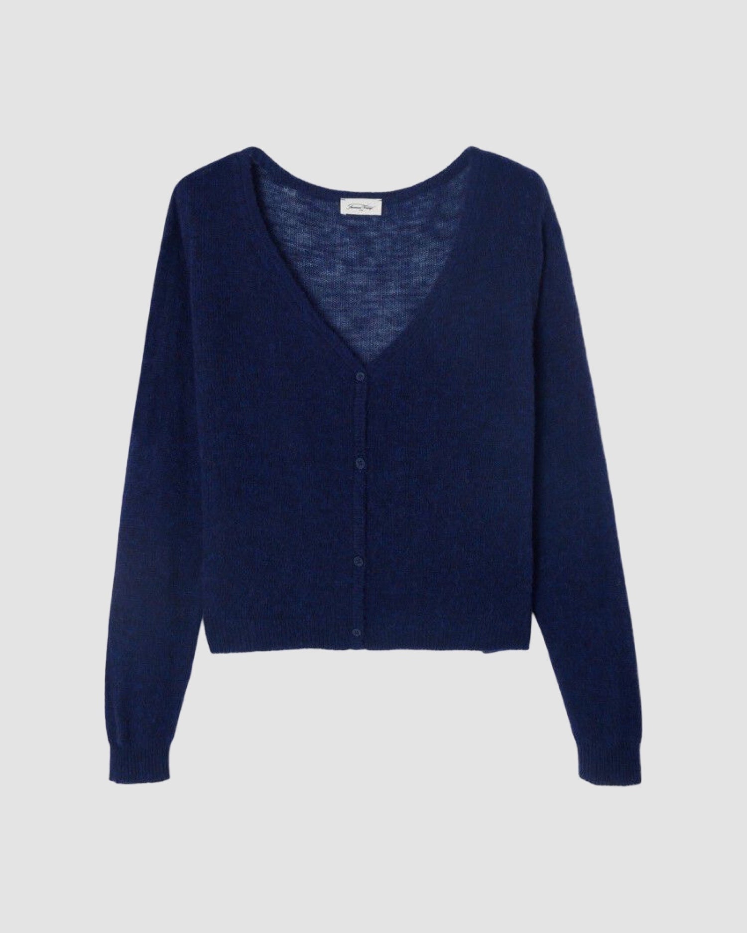 Navy blue cardigan on a light gray background