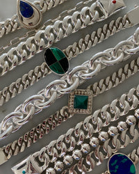 examples of various silver bracelet's in a row