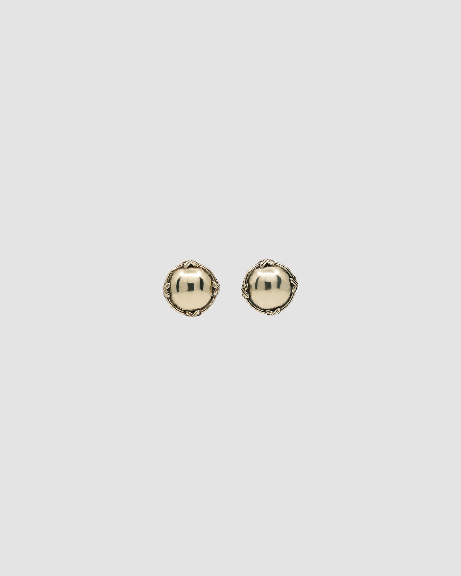 round brass earrings with a border with crosses