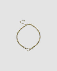 a gold ball chain with a central ring for hanging charns