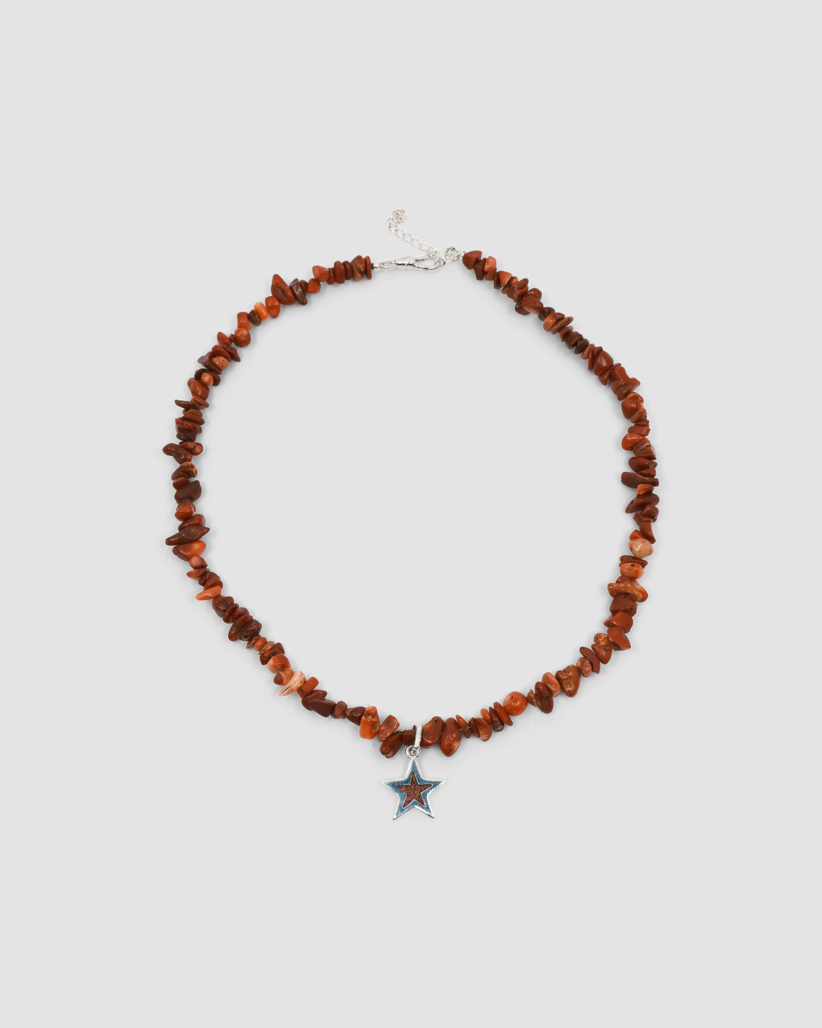 a red coral jagged necklace with a central coral and silver star