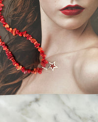 a red coral jagged necklace with a central coral and silver star