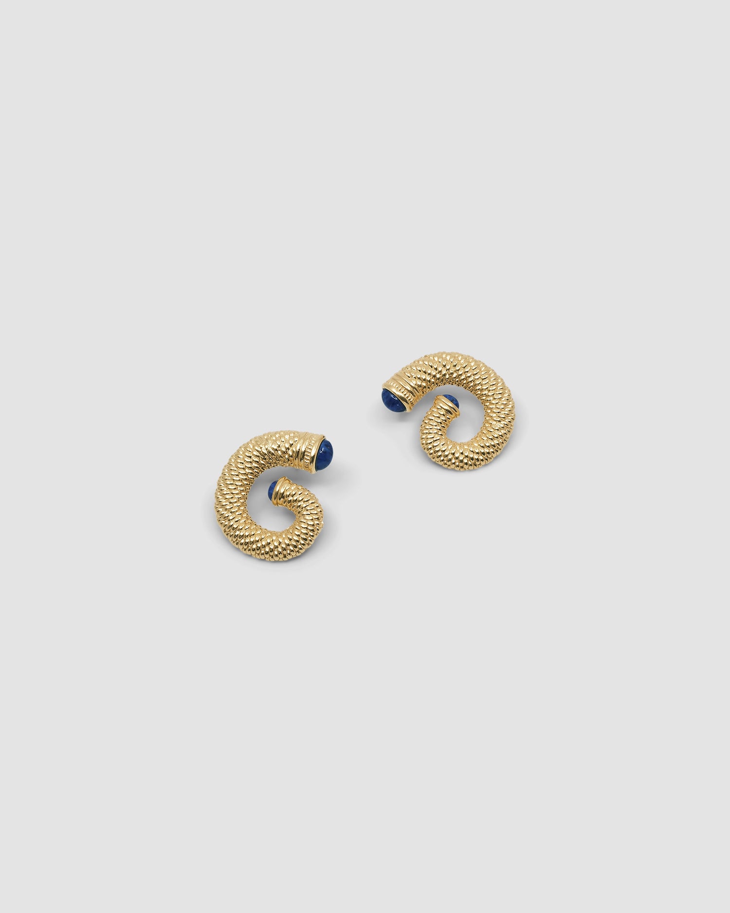 large round swirl textured gold earrings with blue stone ends