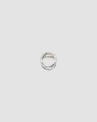 A silver ring made up of a several curved rings joined