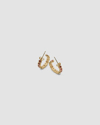 gold hoop earrings inlaid with red crystals