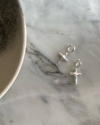 Uneven cross shaped sterling silver matt earrings by Fairley