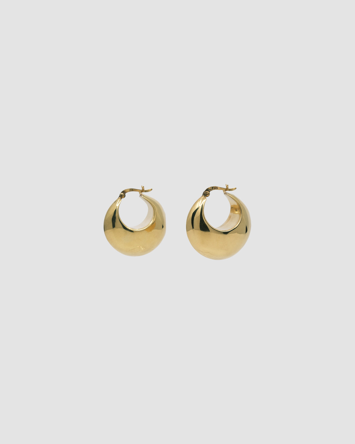 simple crescent shaped fat gold earring with a latch closure