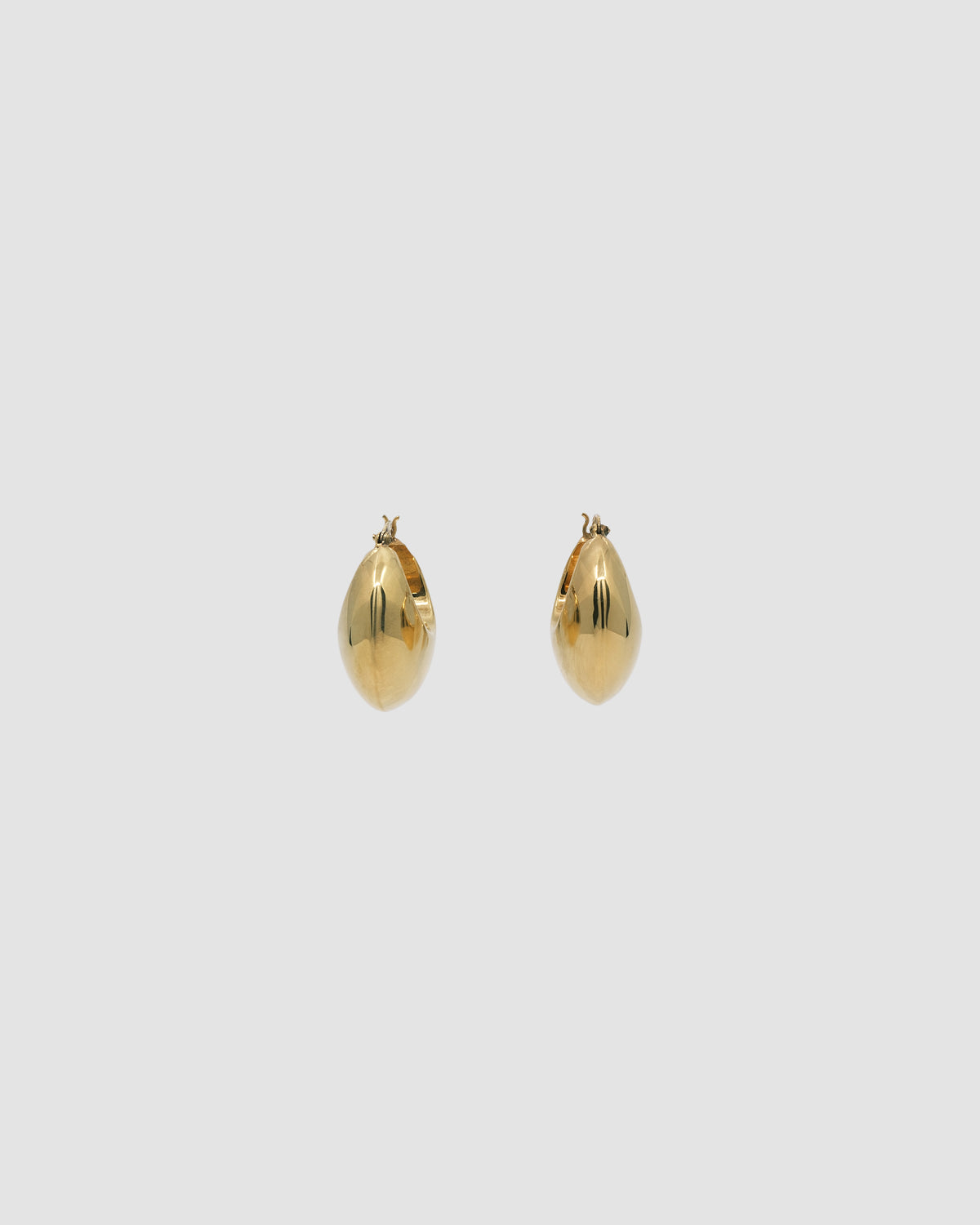 simple crescent shaped fat gold earring with a latch closure