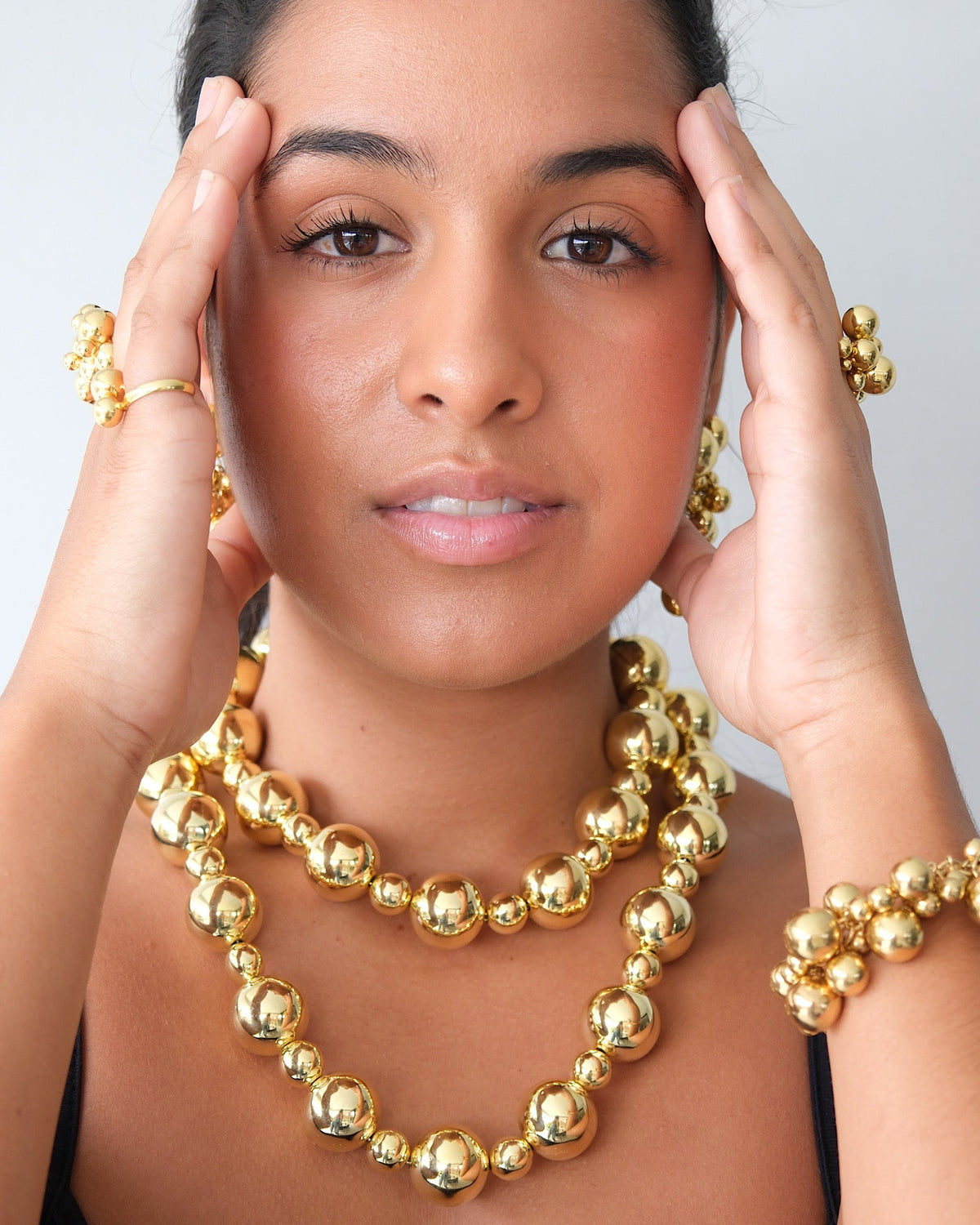 model wears a series on gold bubble jewellery