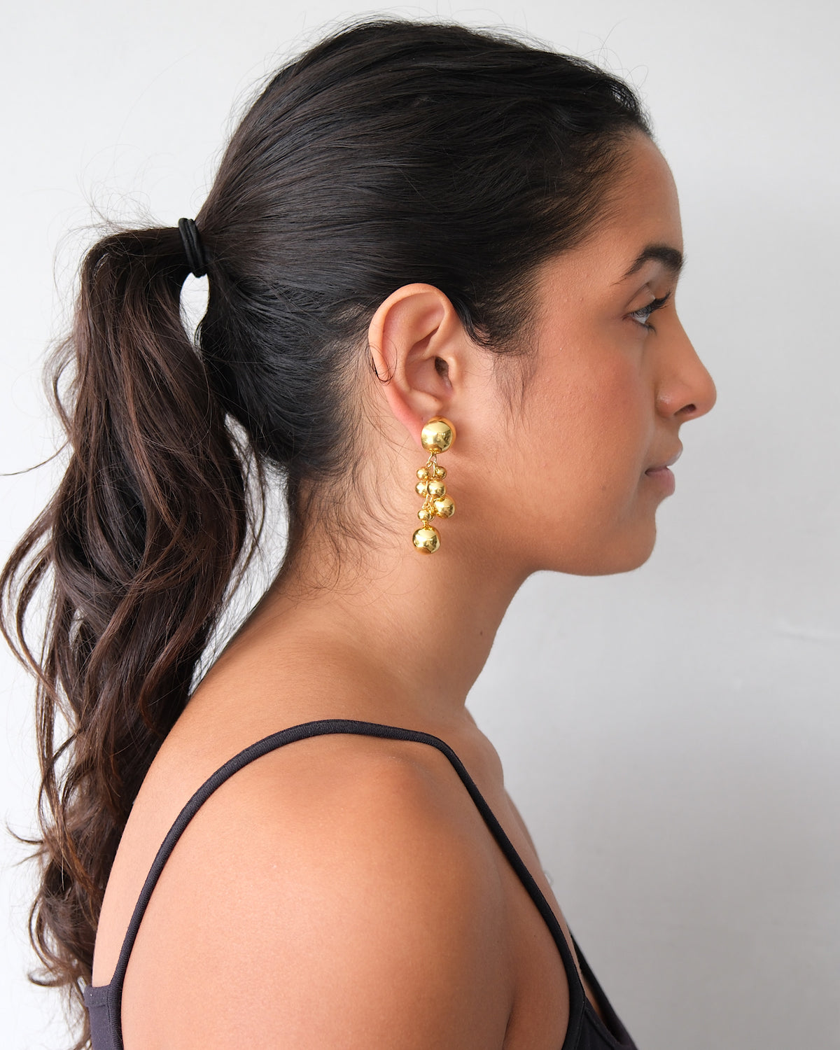 large bubble earrings on a model