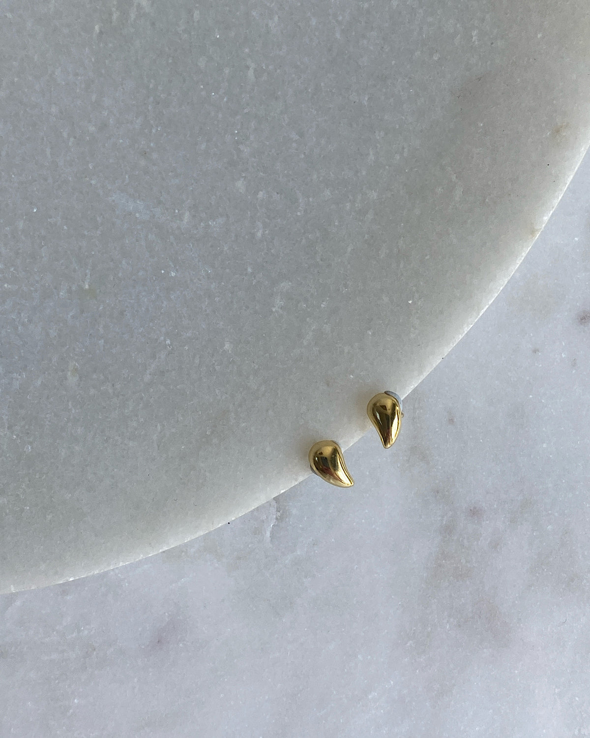 pair of gold bean shaped small studs