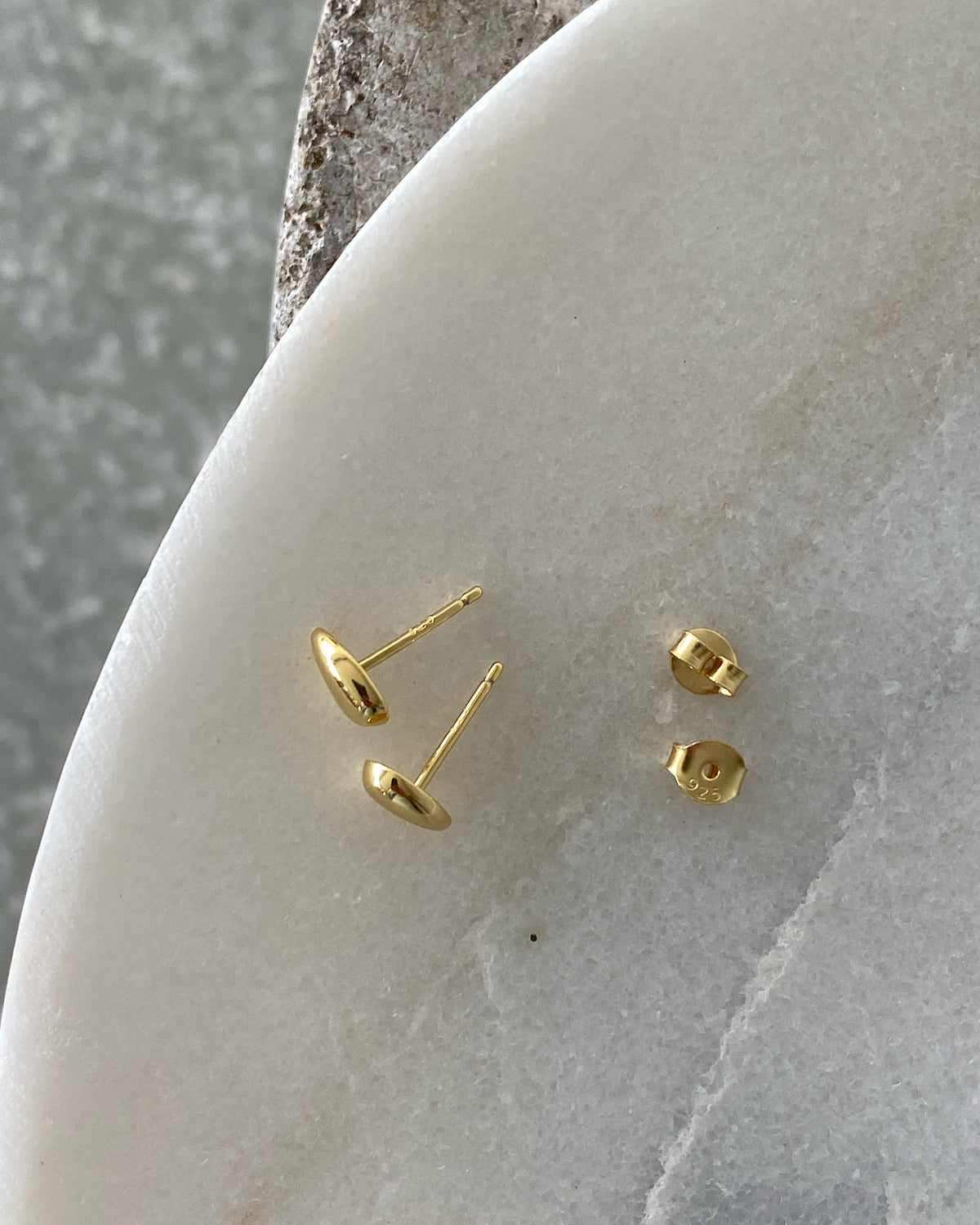 pair of gold bean shaped small studs