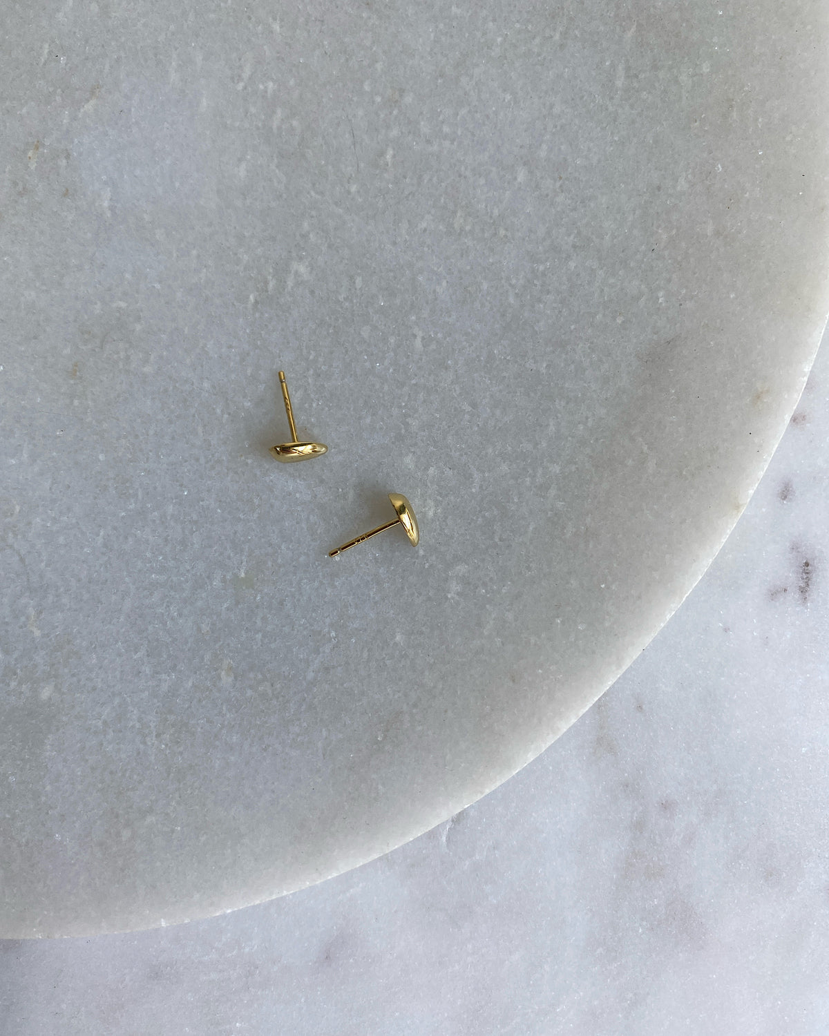 pair of gold bean shaped small studs