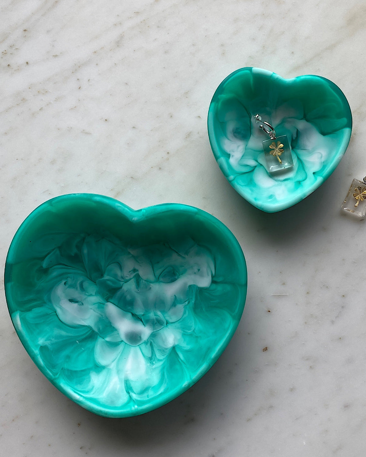 green heart trinket bowl with four leaf clover earrings