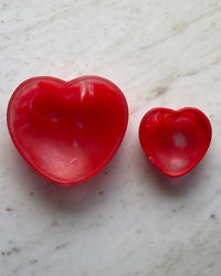 two red heart resin bowls