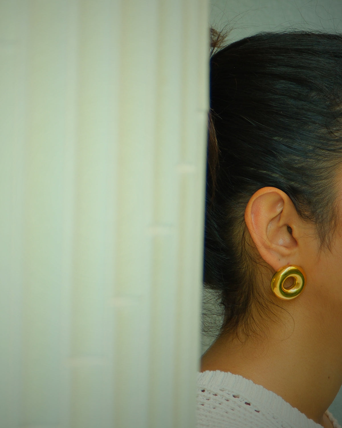 model wear a chubby circle gold earring