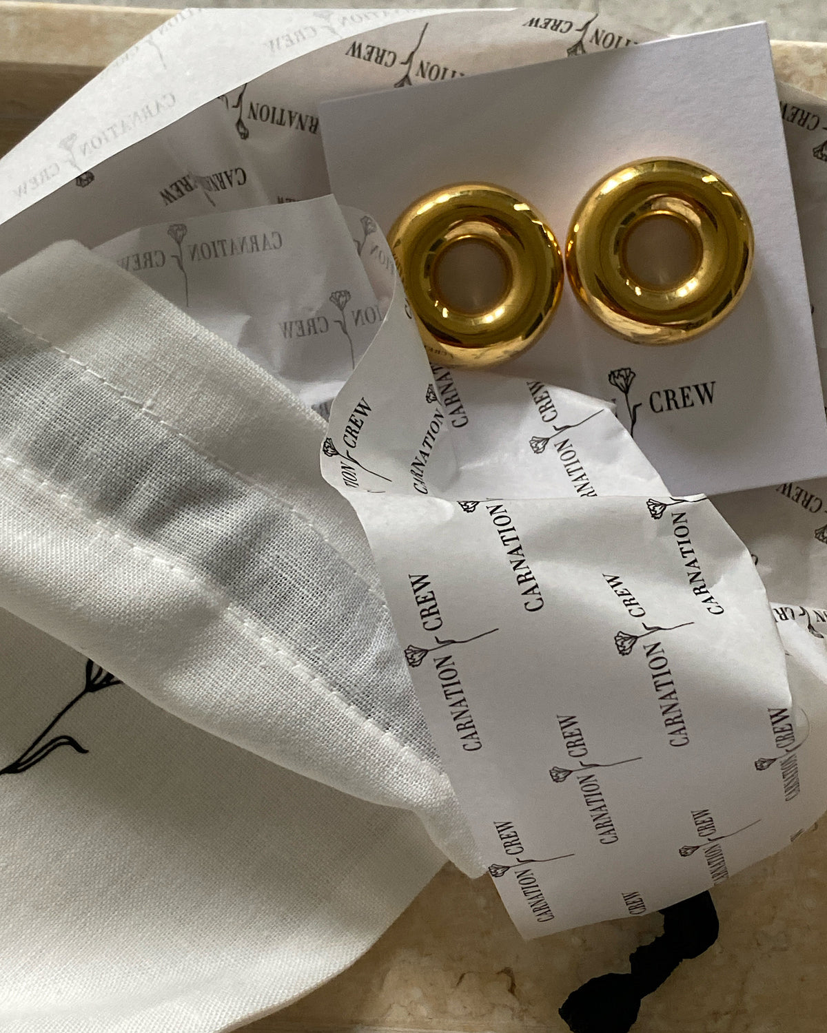 gold packaged indiana hug earrings at the Pared Store